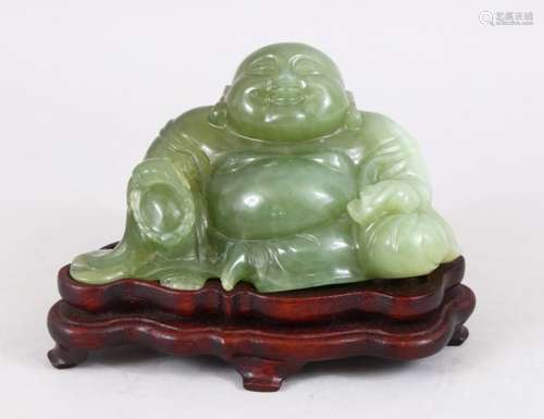 A 19TH / 20TH CENTURY CHINESE CARVED JADE FIGURE OF BUDDHA, in a seated position with a smile on his