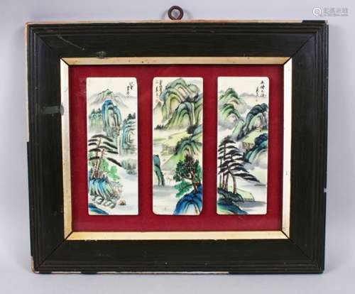 A SET OF THREE 20TH CENTURY CHINESE FRAMED PORCELAIN PLAQUES, each depicting a landscape view with