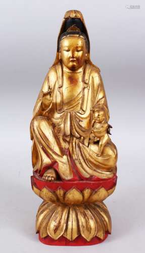 A GOOD QUALITY 18TH / 19TH CHINESE GILTWOOD CARVED FIGURE OF GUANYIN, in a seated position with a