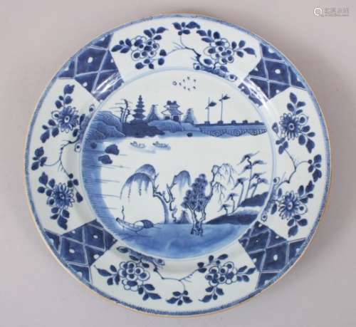 A LARGER THAN NORMALCHINESE KANGXI PERIOD PORCELAIN PLATE, with scenes of lakeside settings, with