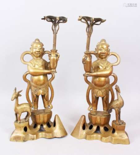 A GOOD PAIR OF LATE 19TH CENTURY CHINESE BRONZE CANDLESTICKS - BOYS WITH CRANE AND DEER, the