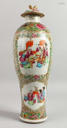 A 19TH CENTURY CANTON VASE AND COVER with panels of figures, flowers etc. 16ins high.