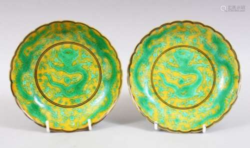 A GOOD PAIR OF CHINESE FAMILLE VERT PORCELAIN DRAGON DISHES, decorated on yellow ground with green