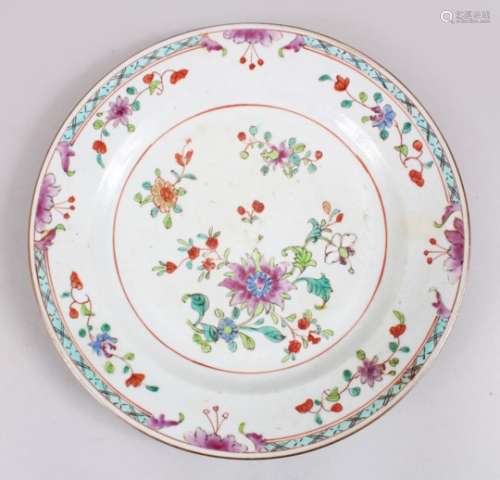 A GOOD 18TH CENTURY CHINESE FAMILLE ROSE PORCELAIN PLATE, decorated with scenes native flora, 22.5cm