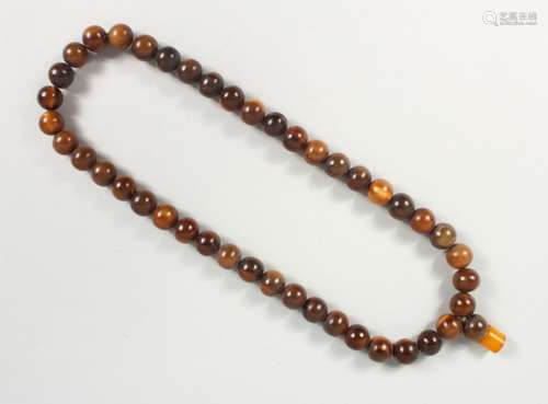 A 19TH CENTURY QING DYNASTY CHINESE RHINOCEROS HORN & AMBER ROSARY BEADS / NECKLACE, comprising of