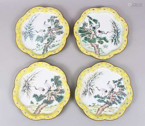 FOUR CHINESE 19TH / 20TH CENTURY ENAMEL DISHES, each depicting the scenes of cranes amongst pine