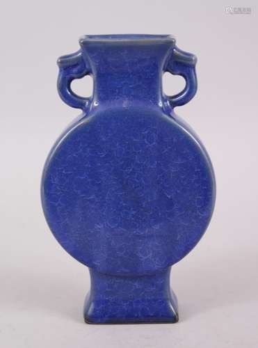 A 20TH CENTURY CHINESE COBALT BLUE CRACKLE GLAZE TWIN HANDLE MOON FLASK, the base bearing a six-