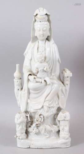 A GOOD CHINESE KANGXI PERIOD BLANC DE CHINE PORCELAIN FIGURE OF GUANYIN AS MADONNA WITH CHILD, the