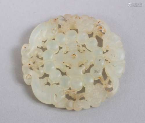 A GOOD 19TH / 20TH CENTURY CHINESE CARVED JADEITE CHILONG ROUNDEL, carved and pierced with chilong