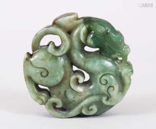 A GOOD 19TH / 20TH CENTURY CHINESE CARVED JADE DRAGON ROUNDEL / PENDANT, 5.5cm diameter.