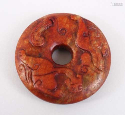 A GOOD 19TH / 20TH CENTURY CHINESE CARVED JADE RUSSET CHILONG BI DISK, 6cm diameter.