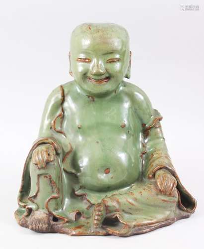 A VERY RARE AND EARLY POSSIBLY SONG - YUAN DYNASTY CHINESE GREEN & BISCUIT GLAZED POTTERY FIGURE