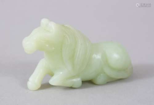 A GOOD 19TH / 20TH CENTURY CHINESE CARVED CELADON JADE RECUMBENT HORSE, 7cm long X 4cm high