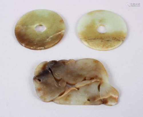 THREE 19TH CENTURY CHINESE CARVED JADE BI DISKS, two bi disks and a pendant in the form of carp
