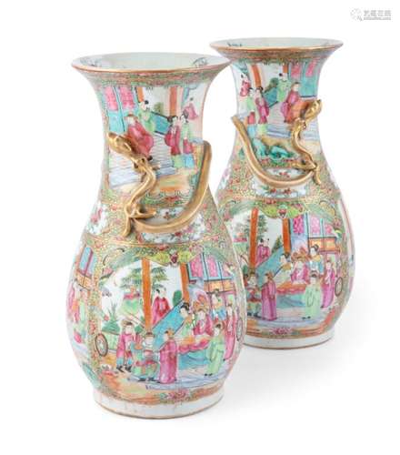 A PAIR OF CHINESE FAMILLE ROSE CANTON VASES, mid-19th century, with pear shaped bodies and flared