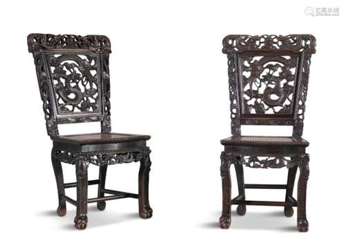 A PAIR OF CHINESE CARVED HARDWOOD SIDE CHAIRS, 19th Century, each with pierced rectangular backs,