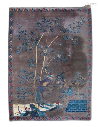 A LARGE CHINESE PEKING CARPET, 1st half of the 20th century, woven with cranes standing by bamboo