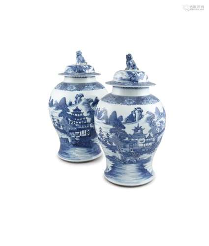 A LARGE PAIR OF CHINESE BLUE AND WHITE URNS AND COVERS, Qianlong (1736 - 95), the detachable tops