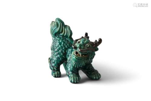 A CHINESE GREEN GLAZED MODEL OF A KYLIN, set on all fours with fierce expression and raised mane.