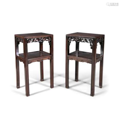 A PAIR OF CHINESE CARVED HARDWOOD TWO-TIER TABLES, each of rectangular form with pierced aprons,