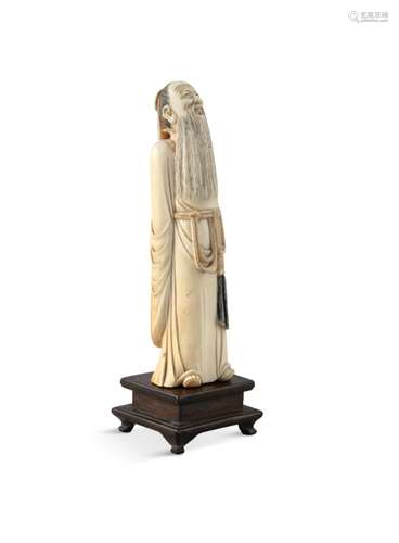 A CHINESE CARVED IVORY FIGURE OF LIU PO WEN, early 19th century, modelled standing wearing a