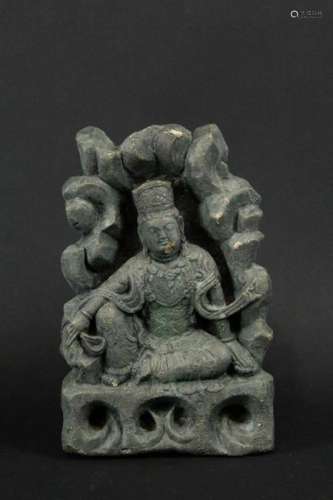 A Carved Stone Figure of Seated Guanyin.
