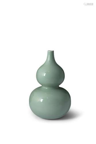 A FINE CHINESE CELADON GLAZED DOUBLE GOURD VASE, Qianlong (1736 - 1795), evenly covered in a soft