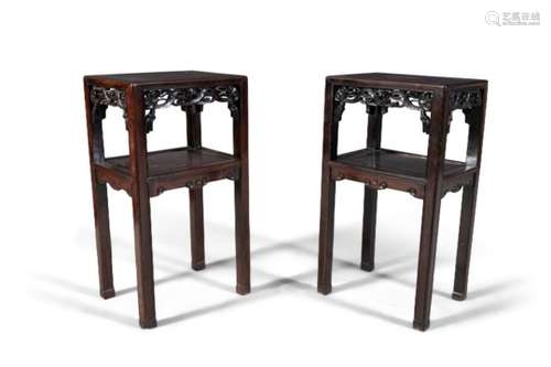 A PAIR OF CHINESE CARVED HARDWOOD TWO-TIER TABLES, each of rectangular form with pierced aprons,