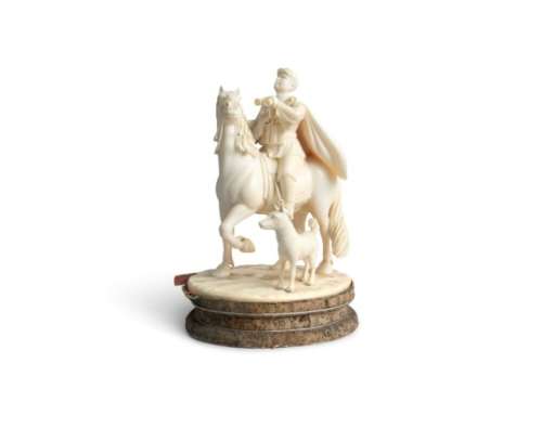 A FINE CHINESE CARVED IVORY GROUP, c.1940, depicting a uniformed soldier on horseback, with canine