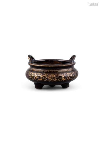A MIRROR BLACK AND GILT DECORATED TROPOD CENSER, Qianlong mark (1736-1795), of compressed form