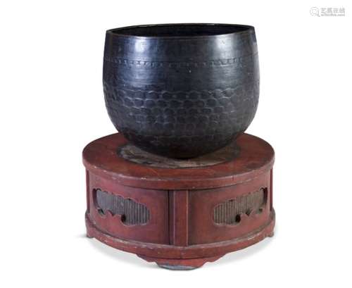 A LARGE JAPANESE TEMPLE BELL 'RIN', Edo/Meiji period, hammered with dimpled body and raised on red