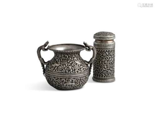 AN INDIAN KUTCH SILVER SUGAR CASTOR, 19th century; together with a two handle bowl, each profusely