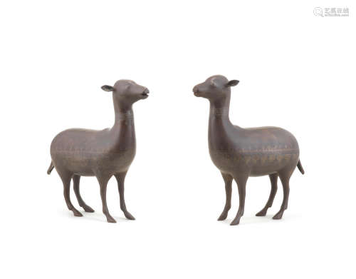 (2) A pair of Qajar silver-damascened steel sheep Persia, 19th Century