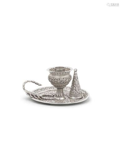 A repoussé silver chamber stick and candle snuffer by Oomersi Mawji Bhuj, 19th Century