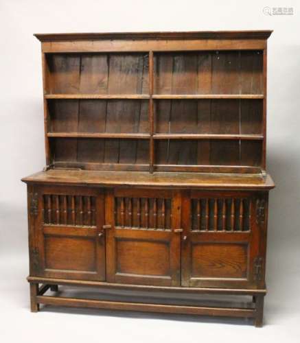 AN 18TH CENTURY OAK DRESSER, with a double Delft rack, the base with three cupboard doors, each part