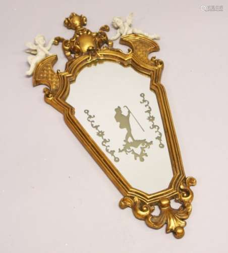 A FRENCH STYLE GILT FRAMED MIRROR, mounted with cherubs. 2ft 10ins high x 1ft 5ins wide.