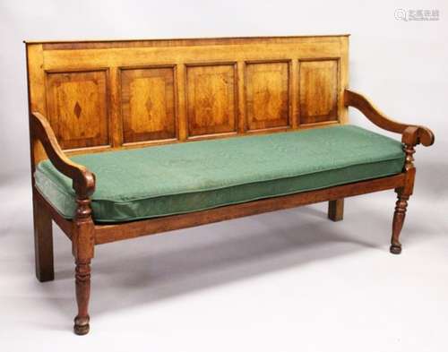 AN 18TH CENTURY OAK PANEL BACK SETTLE, with five mahogany banded panels, loose cushion, on turned