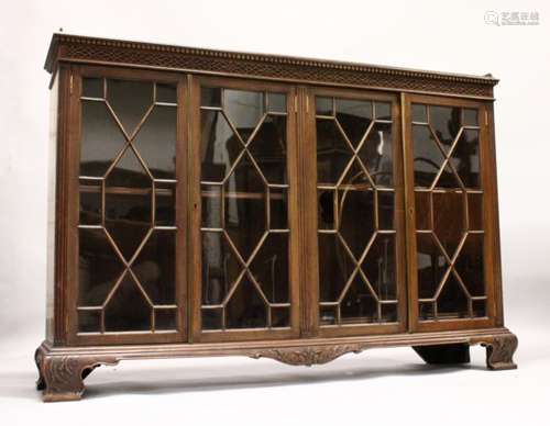 A GEORGE III DESIGN MAHOGANY LOW BOOKCASE, with dentil and blind fret cornice, four astragal