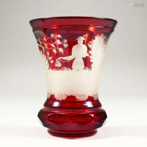A BOHEMIAN RED TINTED BEAKER-VASE, etched with a bear hunting scene. 5ins high.