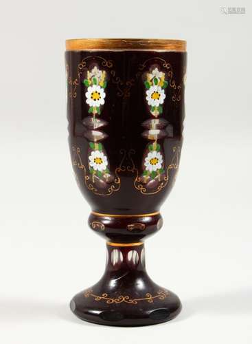 A BOHEMIAN RUBY COLOURED GLASS GOBLET, with painted floral decoration. 7ins high.