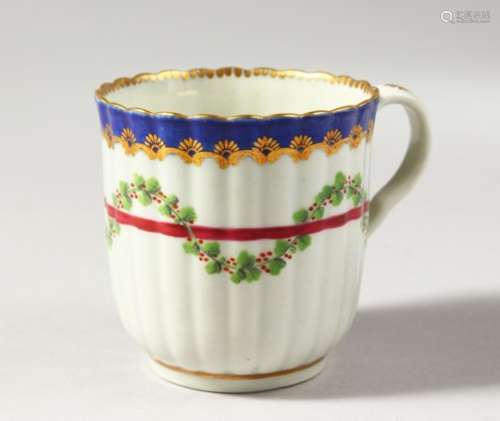 A WORCESTER REEDED COLOURED COFFEE CUP, with blue and gilt border, having a red line entwined with