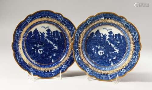 A PAIR OF CAUGHLEY BLUE AND WHITE PLATES, decorated with a complex Oriental landscape with an