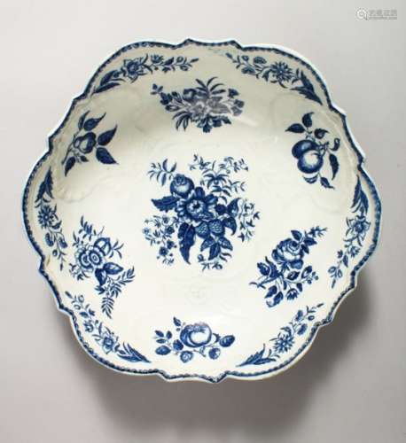 A LARGE WORCESTER BLUE AND WHITE SHELL MOULDED BOWL, decorated with vegetables, butterflies, fruit