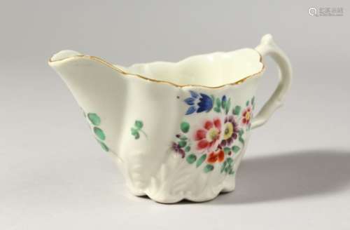 A LOW WORCESTER CHELSEA EWER, painted with coloured flowers, no mark.