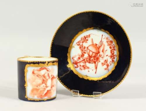 A VIENNA PORCELAIN CUP AND SAUCER, dark blue ground, decorated with a cupid and classical