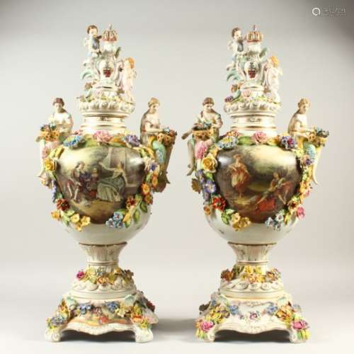 A PAIR OF MEISSEN STYLE VASES, the handles modelled as seated female figures. 74cms high.