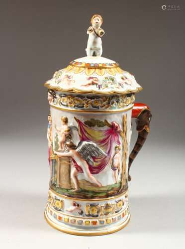 A LARGE CAPODIMONTE TANKARD AND COVER, with classical figures in relief. Mark in blue. 12.5ins