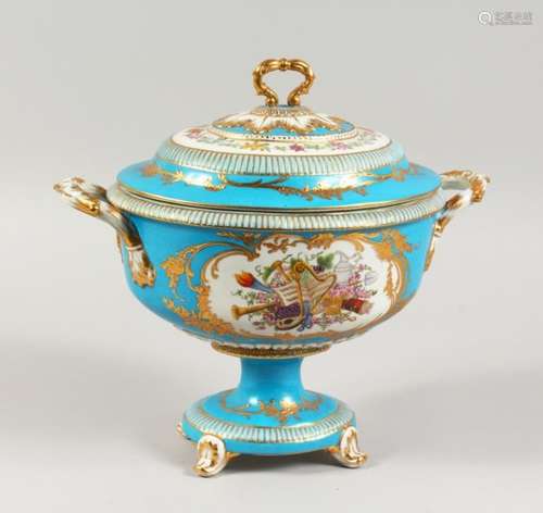 A SEVRES STYLE PALE BLUE GROUND PEDESTAL TUREEN AND COVER, decorated with classical trophies. 12.