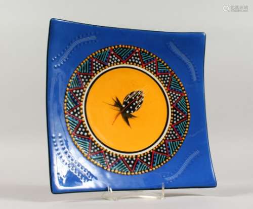 HOLT BAY POTTERY, a square shape dish, blue ground with enamelled decoration. 11ins wide.