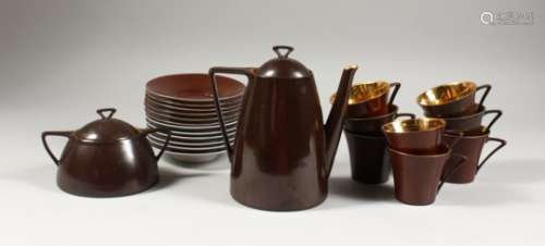 A LIMOGES PORCELAIN PART COFFEE SERVICE, brown glazed, comprising coffee pot, sucrier, eight cups